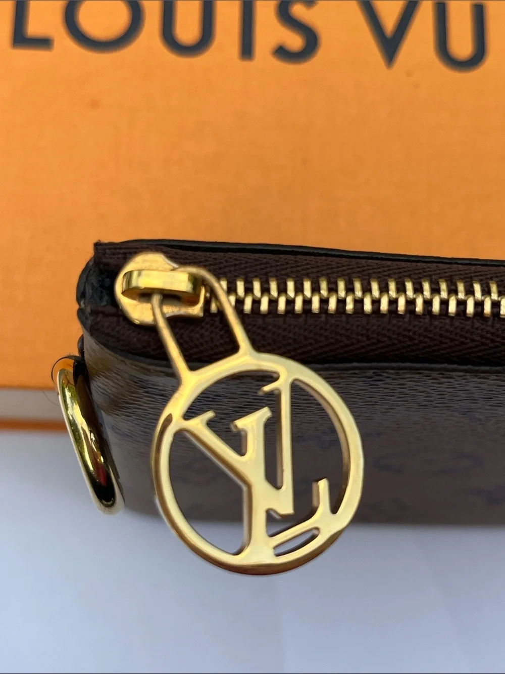 Louis Vuitton LV monogram reverse square pouch from Trio Pouch